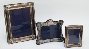 A silver photograph frame, Sheffield 1994, 22 x 17.5cm, and two others, Sheffield 1993 and London