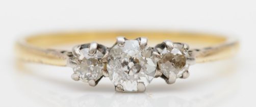 An unmarked gold three stone old cut diamond ring, O, 1.9gm.