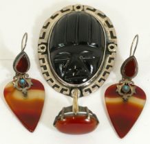 A silver and carnelian dress ring, a similar pair of ear rings and a Sterling silver and hardstone