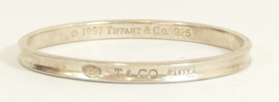 Tiffany & Co., a 1997 silver solid slave bangle, internal 68 x 59mm, 32gm