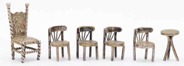 A late 19th century German silver chair, Hanau marks, with embossed decoration and a set of four