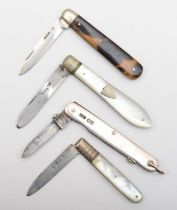 A George IV silver and mother of pearl fruit knife, Sheffield 1823, two others Sheffield 1928 and