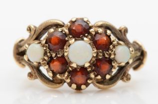 A 9ct gold opal and garnet floral cluster ring, L, 3gm.