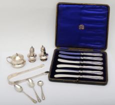 A silver three piece cruet set, Birmingham 1905/07/10, a George III silver pair of sugar tongs, by