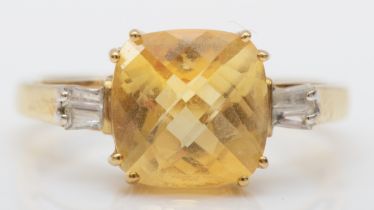 A 9ct gold citrine and baguette cut diamond cocktail ring, O, 2.5gm