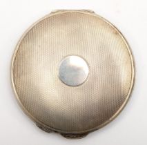 A silver compact, Birmingham 1960, with engine turned decoration, 8cm, 88gm