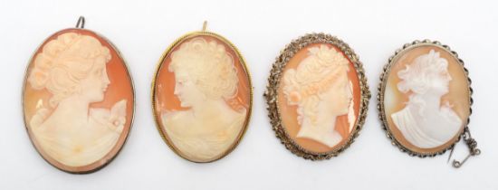 A silver gilt mounted shell cameo brooch, 47 x 36mm and three silver mounted shell cameo brooches.