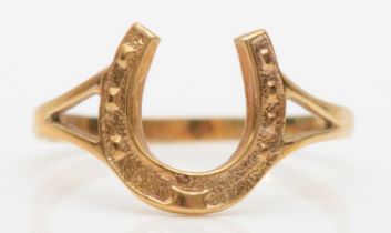 A 9ct gold horseshoe ring, P, 1.3gm.