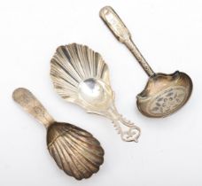 A George III silver bright cut caddy spoon, Birmingham 1799, a George III silver shell bowl caddy