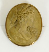 A Victorian silver gilt mounted lava cameo brooch, carved to depict Flora, 40 x 34mm