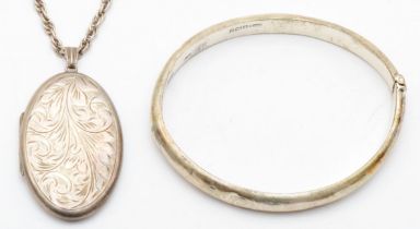 A silver hinged locket, Birmingham 1971, 44 x 27mm, chain, and a silver hinged bangle, 37gm