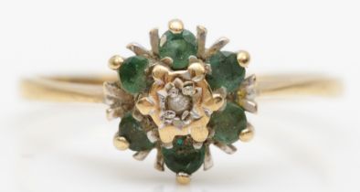 A 9ct gold emerald and illusion set diamond cluster ring, N, 1.4gm.