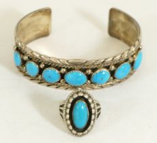 A Native American Sterling silver and turquoise bangle by JS and a similar ring, 43gm