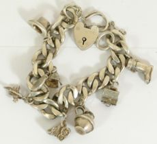 A heavy silver charm bracelet, 79gm