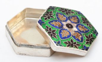 An unmarked silver and enamel octagonal box, with pull off cover, 4cm, 26gm