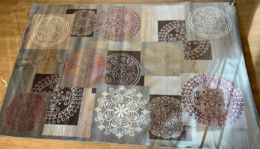 A contemporary brown background silk/wool mix rug embroidered with roundels of Eastern style