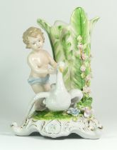 A late 19th century German porcelain vase, depicting a boy standing next to a flower bud shaped