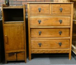 A 1930s oak chest of two short over three long drawers, raised on tapering supports, 76cm wide,