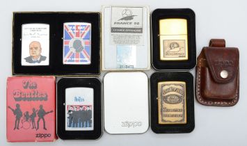 Five various Zippo lighters and a leather case