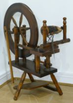 A late 20th century wooden spinning wheel, 83 x 65cm.