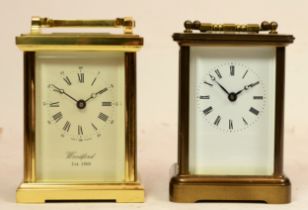 Two English 8 day carriage clocks, brass cased having enamelled dials with Roman numerals, 12cm