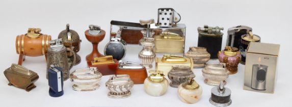 A collection of mid 20th century and later table cigarette lighters, gas and petrol examples.