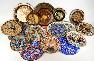 A box of 20th century Iznik style ceramics, together with a pair of Egyptian painted wooden plates