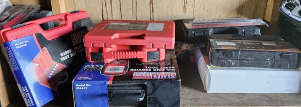 A shelf of tools to include service reset equipment