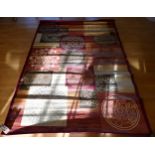 A contemporary red/pink silk mix rug with Eastern style roundels, 288x196cm together with a