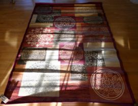 A contemporary red/pink silk mix rug with Eastern style roundels, 288x196cm together with a