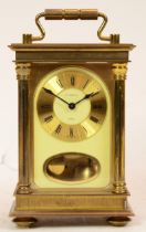 A 1980s West German carriage clock, retailed by H. Samuel, the eight day movement striking on a