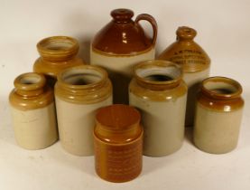 A small quantity of 20th century brown painted stoneware flagons and storage jars, together with a