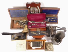 A group of cased writing instrument sets, a Roneo Cecure punch, and a barometer.