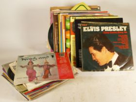 A collection of vinyl LP's to include Elvis Presley's 'Easy come, Easy go', Glen Miller and more