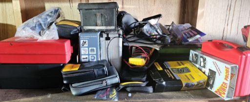 A shelf of mainly power probe tools by Fluke