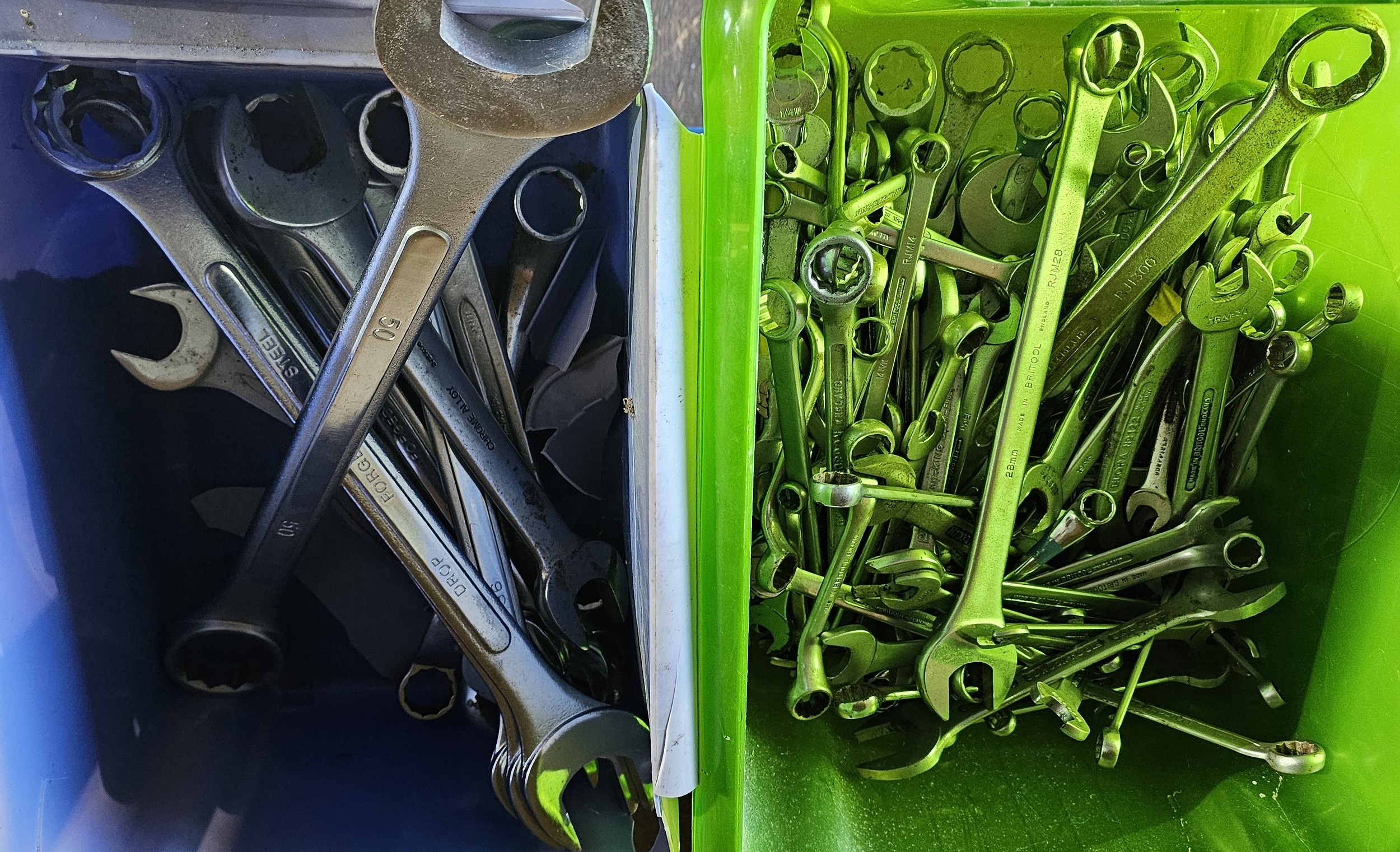 Two containers of spanners