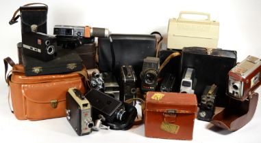 A collection of early 20th century and later vintage technology, including various cine cameras,