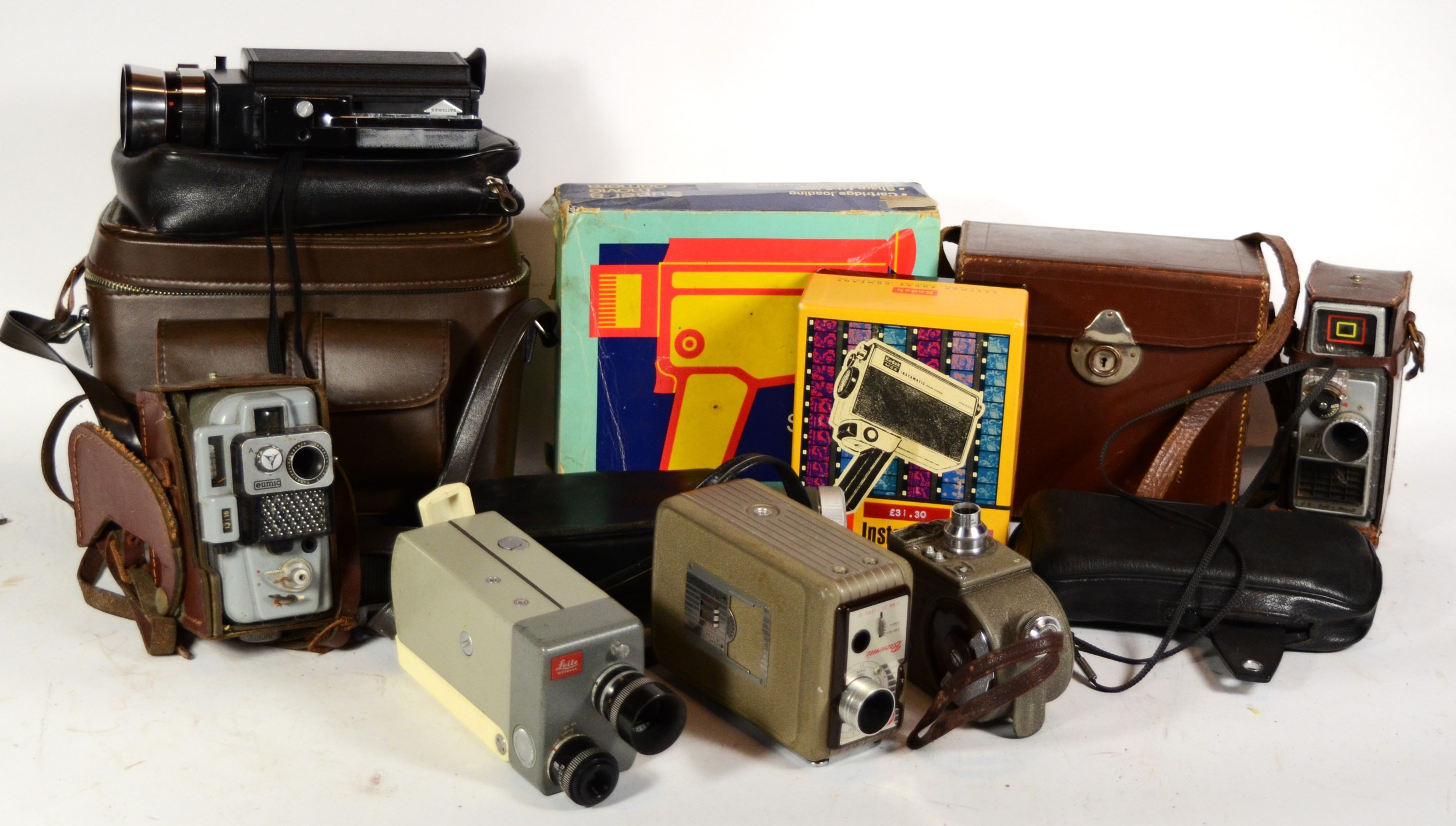 A collection of early 20th century and later vintage technology, including various cine cameras,