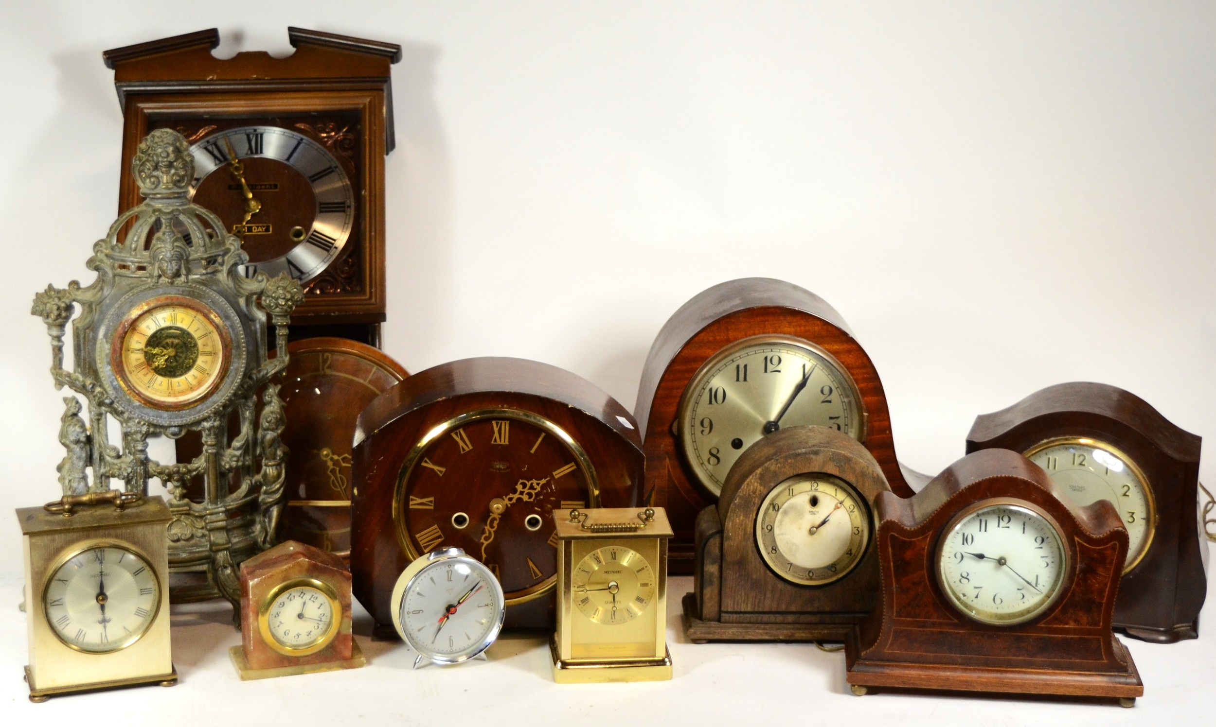 A collection of mid 20th century and later mantel clocks, having manual and quartz movements, in