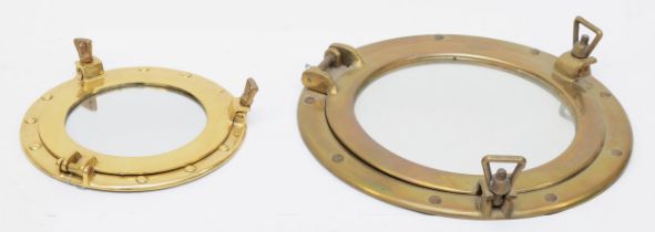 Two brass porthole style circular mirrors, 30cm and 20cm diameter