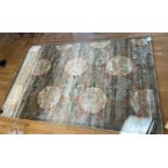 A contemporary grey ground silk mix rug with leaf decoration, 290x195cm together with a woolen