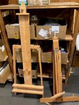 Two contemporary beech floor standing artists easels