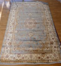 A purple and cream background wool/silk mix rug with floral decoration, 246x158cm together with a