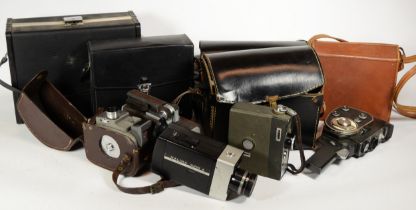 A collection of early 20th century and later vintage technology, including various cine cameras,