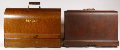 A 20th century cased Singer sewing machine, together with another cased sewing machine.