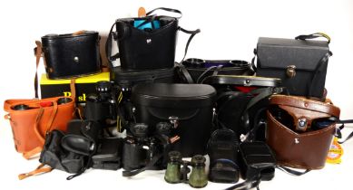 A collection of mid 20th century and later cased pairs of binoculars.