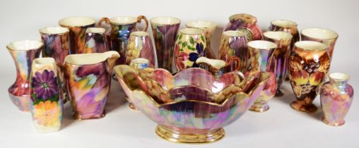 Oldcourt ware, a group of ceramics to include a clock, a twin handled vase, and jugs.