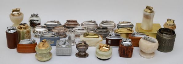 A collection of mid 20th century table cigarette lighters, primarily by Ronson, petrol and gas