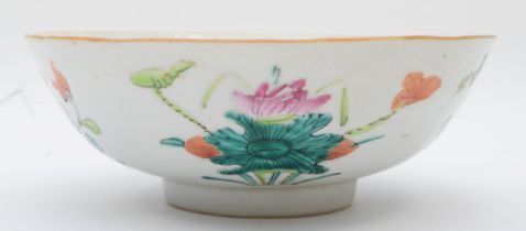 A Chinese porcelain famille rose bowl, painted in overglaze enamels to show garland and flowers,