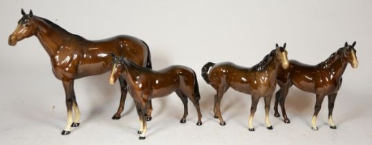 A collection of four Beswick horses, to include mid brown colourway, chestnut brown, various sizes